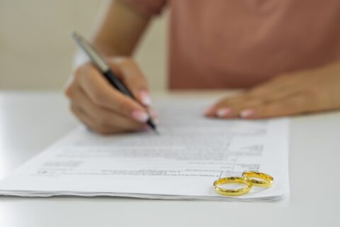 A Woman Signing Her Divorce Papers in Tucson, AZ & Pima County